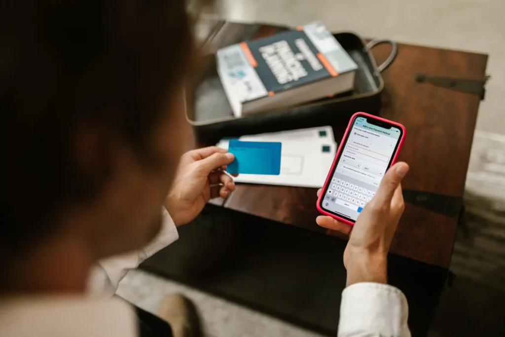 A person adding a bank card to a payment app on their phone